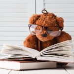 Kid education concept, eddy bear with book